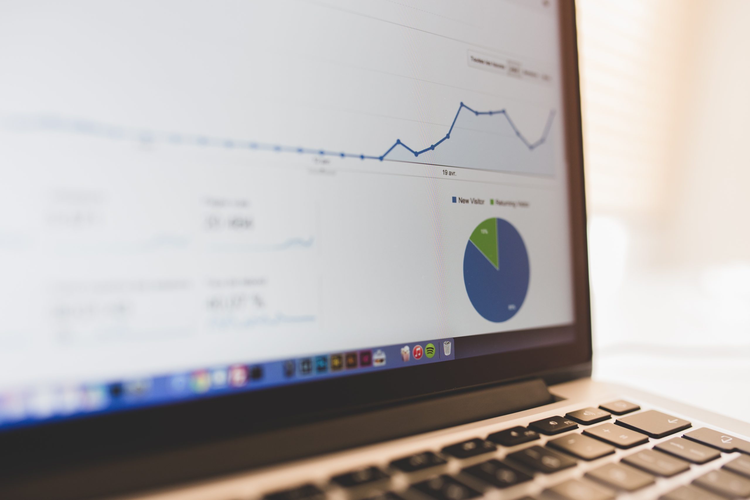Laptop displaying analytics charts for ecommerce checkout tracking QA and developer review