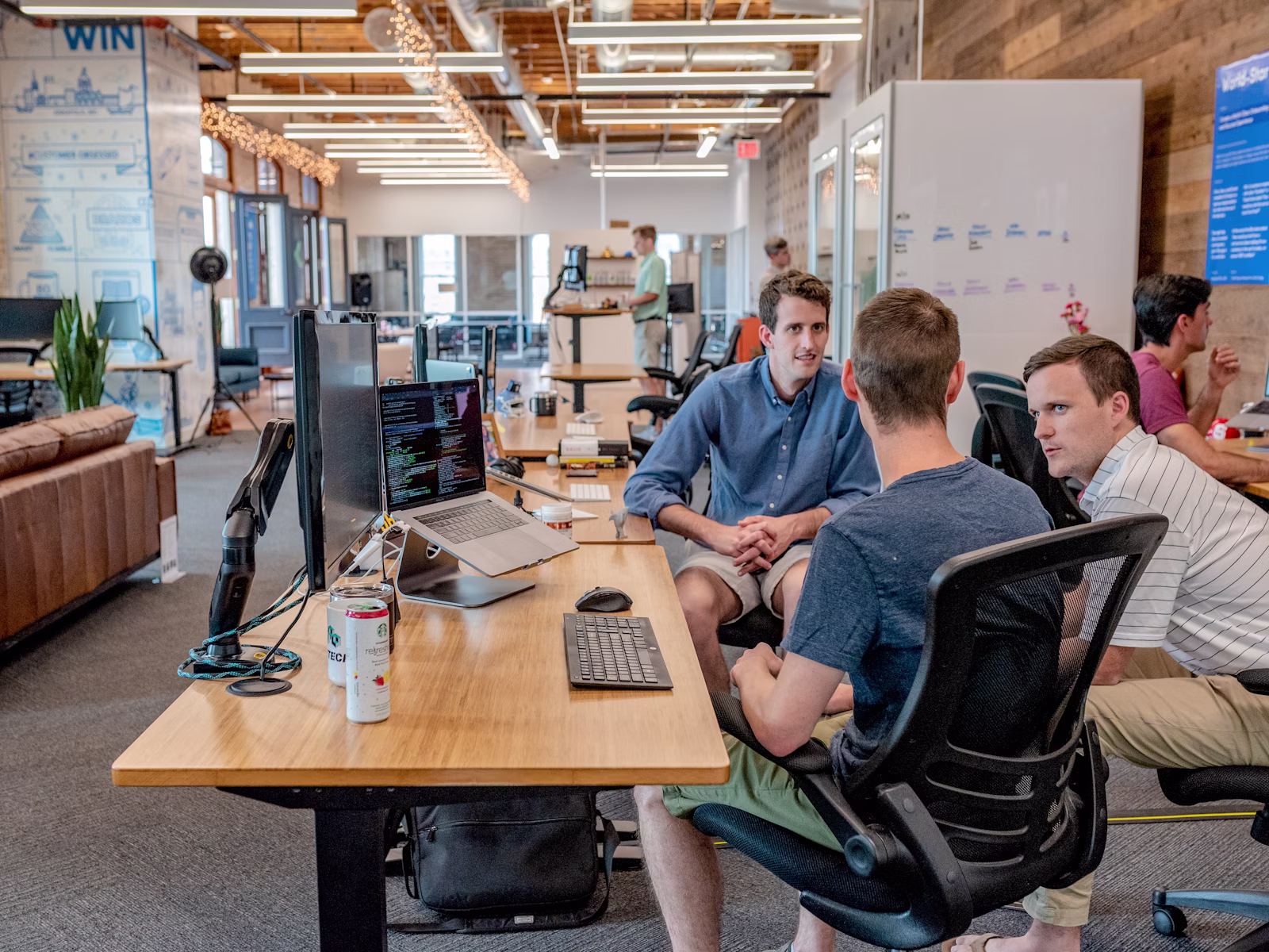 Business team reviewing ecommerce platform planning on a laptop