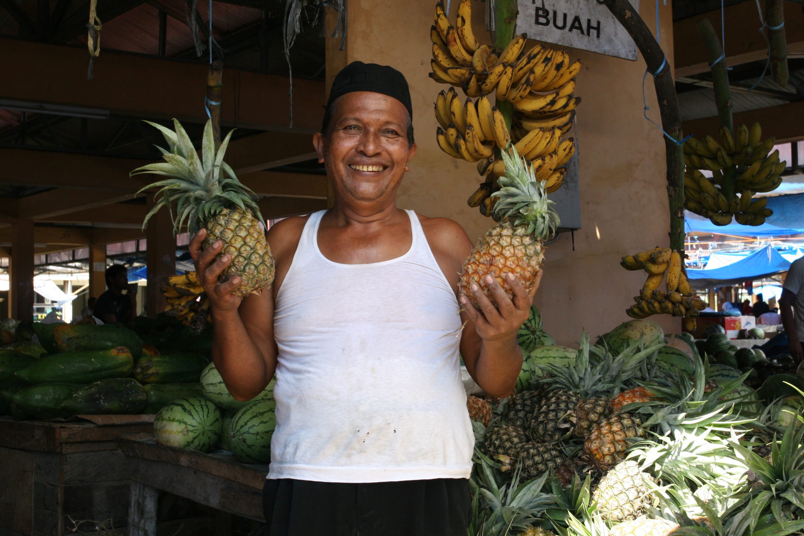Small business owner at a shop counter representing a clear, customer-focused local business website