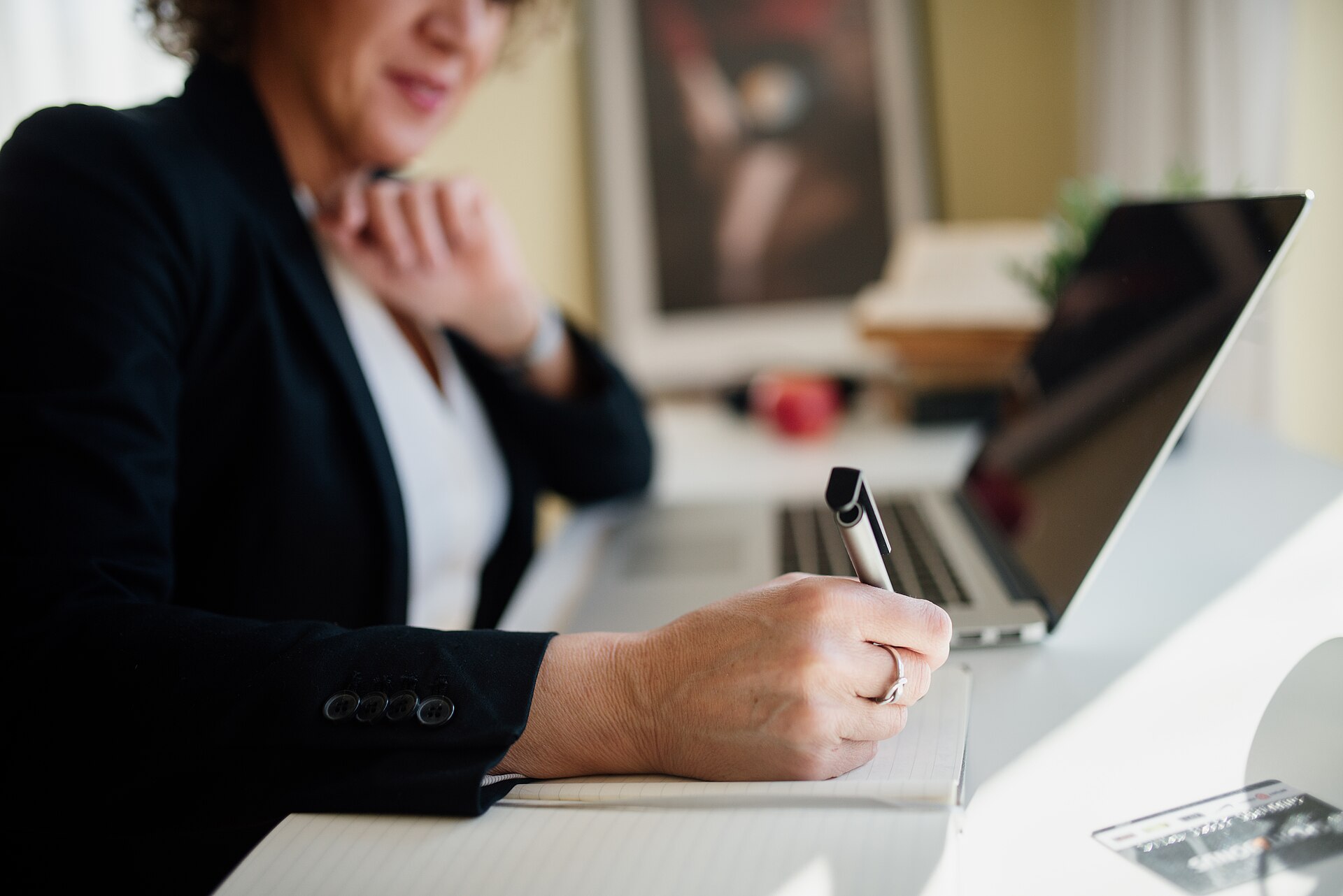 Business professional reviewing website service pages on a laptop