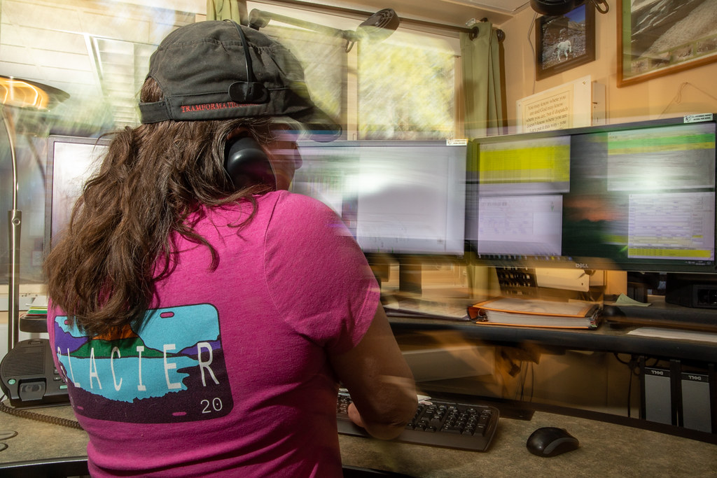 Business staff member answering a phone call at a desk
