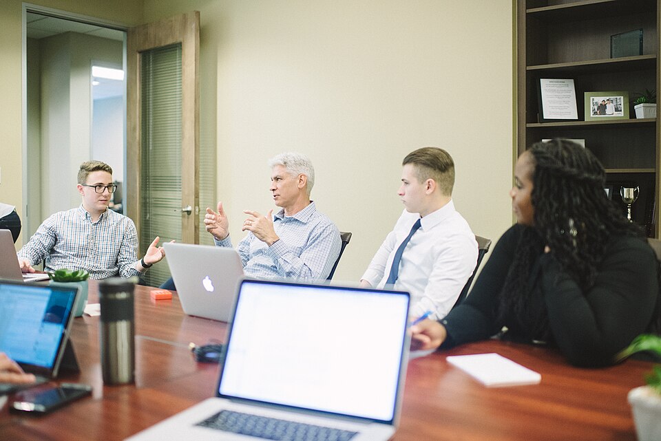 Business team reviewing lead quality and website performance in a meeting