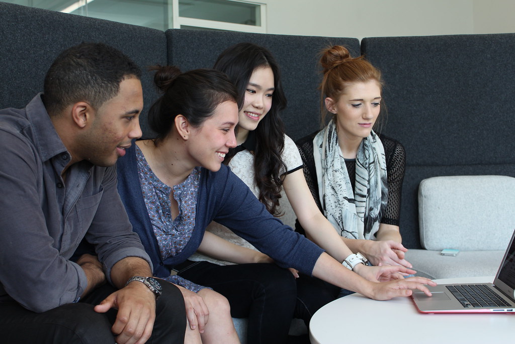 Business team reviewing website SEO and navigation changes on laptops